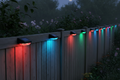 Đèn RGB solar fence light trên hàng rào gỗ ban đêm